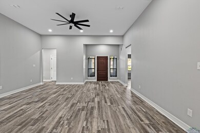 Unfurnished living room with hardwood / wood-style