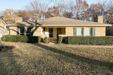 Single story home featuring a front lawn