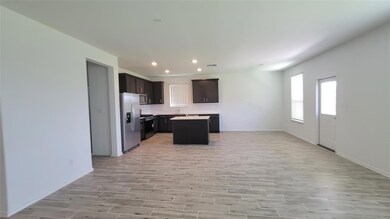 Kitchen featuring open floor plan, recessed light