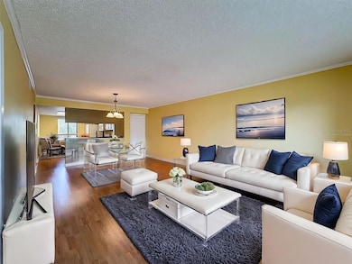 Virtually Staged- View of the living and dining room from the balcony