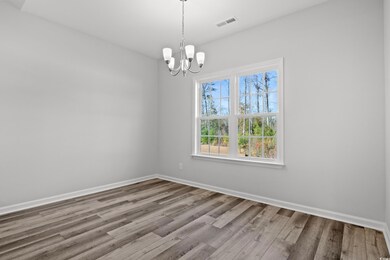 Spare room with hardwood / wood-style floors and a