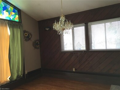 Lots of windows and oak floor in the formal dining