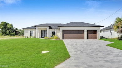Prairie-style house with a front lawn, decorative driveway, stucco siding, an attached garage, and roof with shingles
