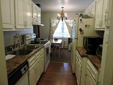 Kitchen. Lovely white kitchen open to dining room.