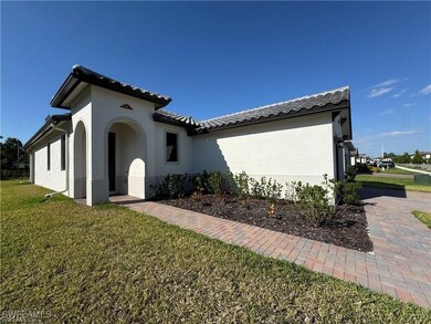 View of home's exterior with a yard, stucco siding