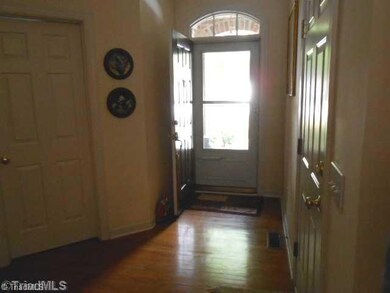 Entry. Hardwood floors upon enrty. Living area, dining and kitchen also have hardwoods.