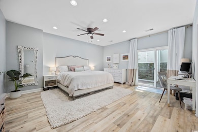 Bedroom featuring access to outside, light wood-style flooring, recessed lighting, an office area, and a ceiling fan