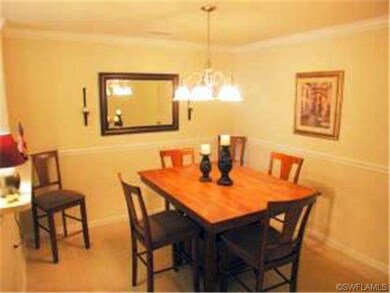Comfortable dining area separated by wall from liv
