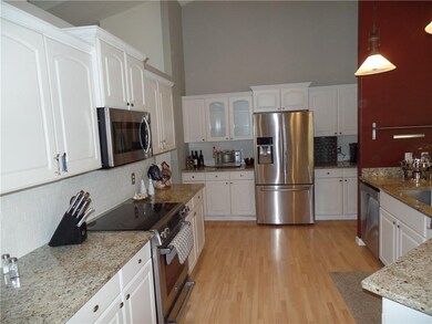 Updated kitchen with stainless steel appliances, granite counter tops and subway tile back-splash.