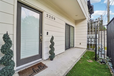 First floor front door is gated and opens to a sid