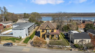 Aerial view of residential area featuring a large body of water