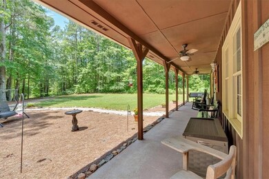 View of patio featuring ceiling fan