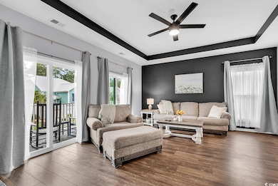 Living room featuring dark hardwood / wood-style f