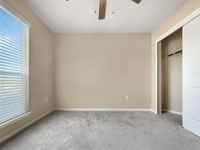 Unfurnished bedroom with carpet flooring, a close