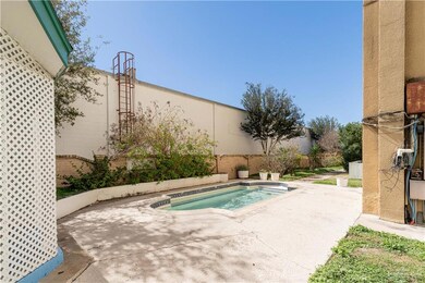 View of swimming pool featuring an outdoor hot tub and a patio