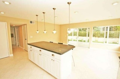 Open Kitchen to Family Room and Sliding Door to Ba