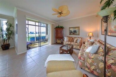 Tiled living room featuring ceiling fan and orname