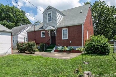 Concrete patio, partially fenced in yard