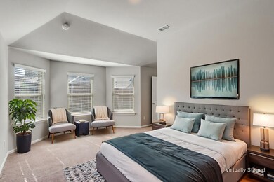 Carpeted bedroom with baseboards