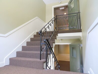 Common hallway Building 128 shows stairs & shadow 
