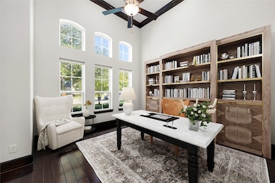 The elegant home office offers soaring ceilings, rich hardwood floors, and a wall of windows that fill the space with natural light, the perfect blend of sophistication and functionality for working or studying from home. *Virtually Staged