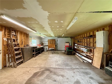 Second garage with separate man door and full drive thru access