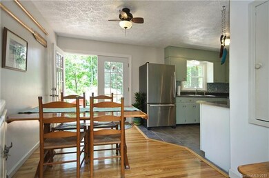 Dining and kitchen opening through french doors to