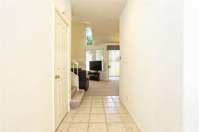 Tiled entry leads you into the open floor plan of 