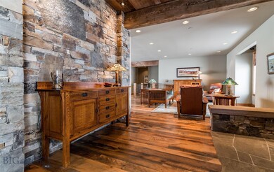 Circle sawn hardwood floors, stacked rock wall, an