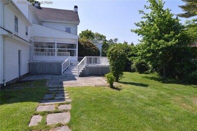 EXTERIOR REAR DECK OFF SOLARIUM W VIEW OF POND