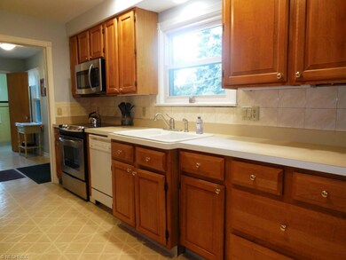 Updated kitchen features a ton of cabinets and cou