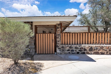 Doorway to property with fence and a gate