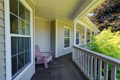 Wrap around porch w/mahogany decking & Trex rail.
