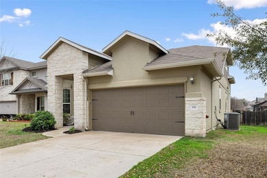 View of front of house with stone siding, stucco siding, roof with shingles, concrete driveway, and an attached garage