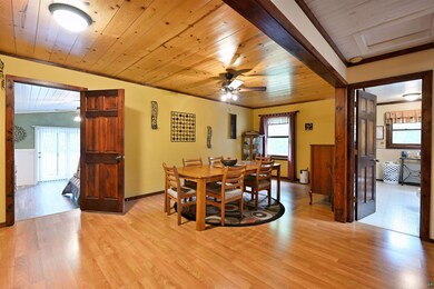 Dining room featuring ceiling fan, wood ceiling, and light wood-style floors