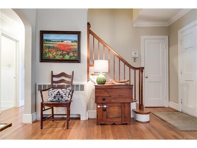 Coat closet next to the staircase