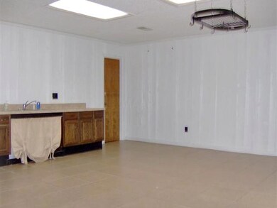 Tile floored bonus room  20 x 18 ft, located in th