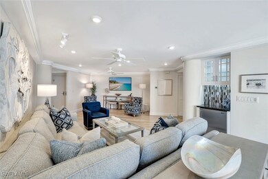 Living area with baseboards, a dry bar, ornamental molding, and recessed lighting