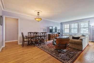The living room / dining room with south facing wi