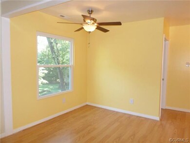 Open dining room area with new laminate wood floor