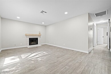 Unfurnished living room featuring light wood-style