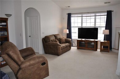 Living Room w/Gas Fireplace & Vaulted Ceiling