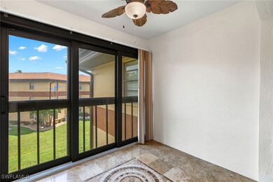 Spare room featuring a ceiling fan and stone finis
