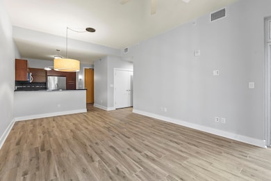 Unfurnished living room featuring ceiling fan, vi