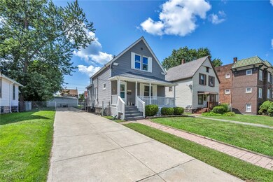 Bungalow-style home with a front yard and covered porch