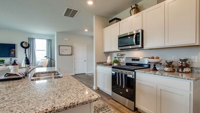 Pictures of another model- The Aisle in Legacy Farms will feature quartz countertops throughout, kitchen backsplash and under cabinet lighting.
