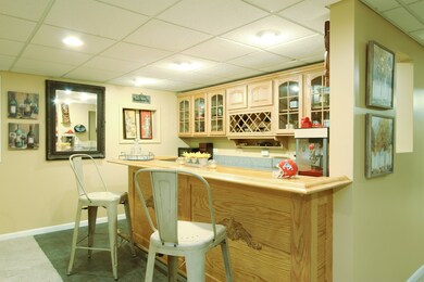 Wet Bar with Custom Built-In Shelves in the Baseme