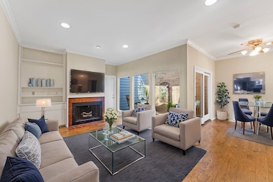 Cozy up by the fireplace in this airy living space