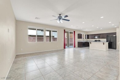 Unfurnished living room featuring light tile patte