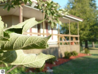 View of the front yard and porch. There are severa